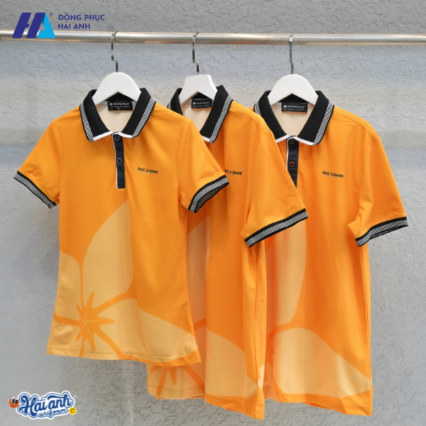 Thiết kế kiểu dáng chuẩn, chất liệu tốt, logo tạo điểm nhấn cho chiếc áo đồng phục công ty màu cam hoàn toàn phù hợp với tiêu chí của doanh nghiệp
