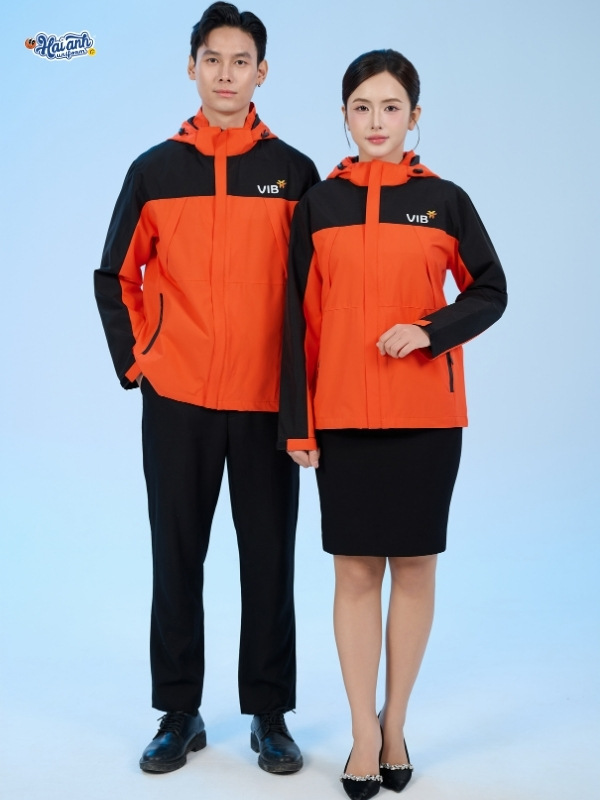 Mẫu áo khoác đồng phục công ty Fastuni màu cam phối đen VIB